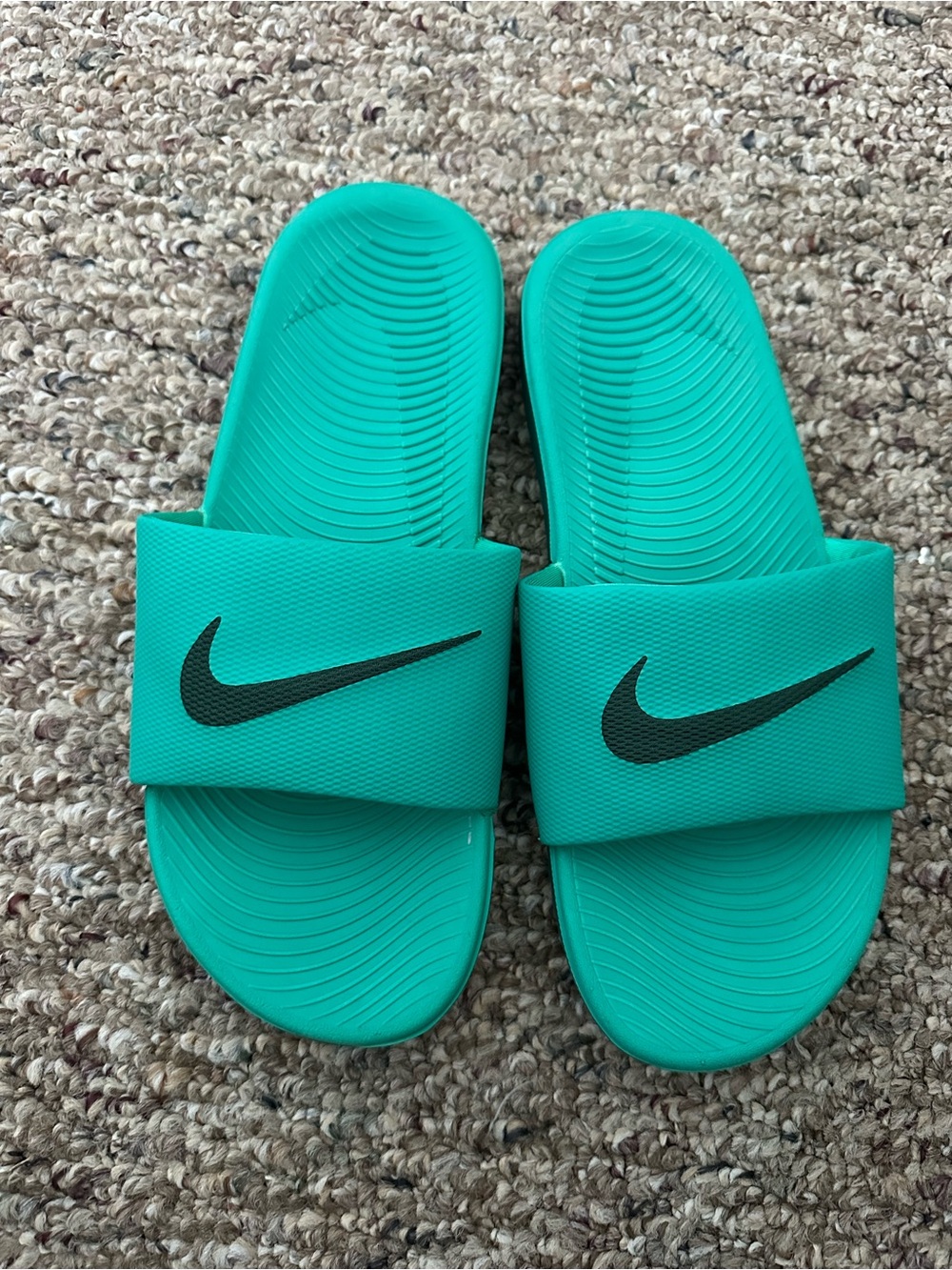 Nike Womenโs Teal Slide Sandals with Black Swoosh